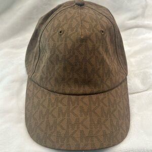 NWT Michael Kors Signature fabric brown cap with adjustable back.